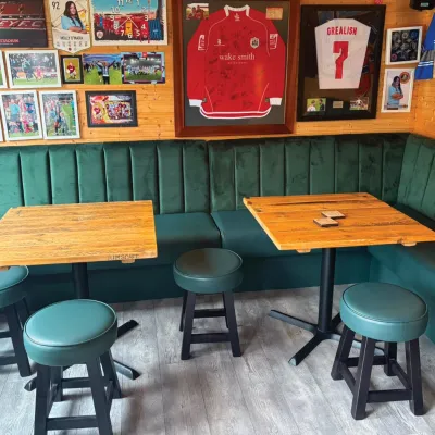Green Bench Seating With Matching Stools